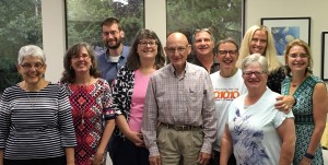 Jerry Bitz (center) is surrounded by members of the NCC Board of Directors, from left Sr. Sarah Deeby, Executive Director Erin Peters, Kyle Eilenfeldt, Christine Tracey, Rich Katz, Natalie Osburn, Julie Rowland, Bethany Bacci, and Michelle Meyer.