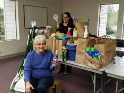 Cleanup drive leader Nyssa Howell (back) shows off the haul with NCC cofounder Sr. Sarah Deeby.